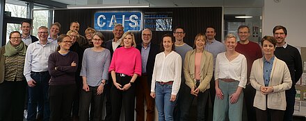 scientists stand together at CAIS